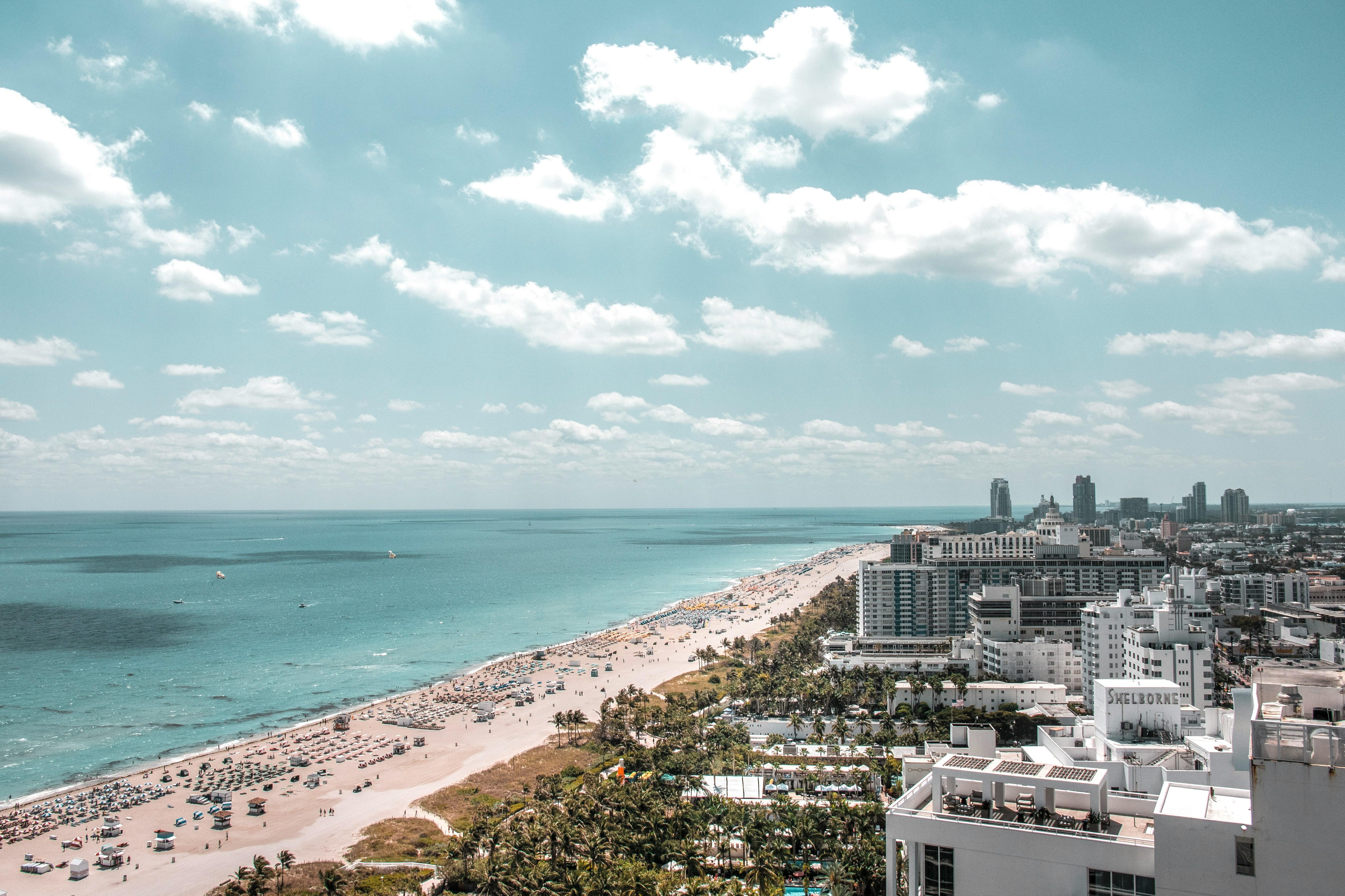 Aerial view of Miami South Beach coastline with turquoise ocean and beachfront hotels